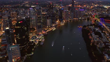 Eagle-Street-Pier-At-Brisbane-Riverfront-With-Beautiful-Story-Bridge-Over-Brisbane-River-In-Queensland,-Australia-At-Night