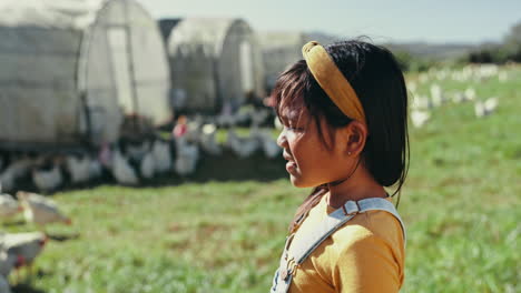 Child,-laughing-or-girl-on-chicken-farm