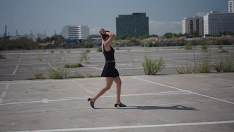 woman walking in urban parking lot