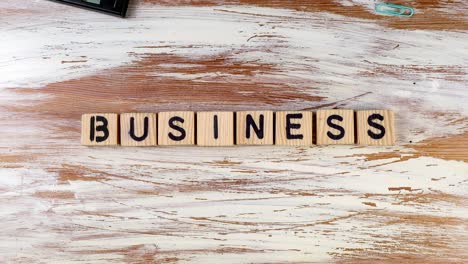 business. wooden alphabet blocks create text on the table