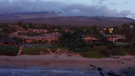 Close-up-dolly-aerial-shot-of-the-luxury-beach-resorts-along-the-coast-of-Wailea-at-sunset-in-South-Maui,-Hawai'i