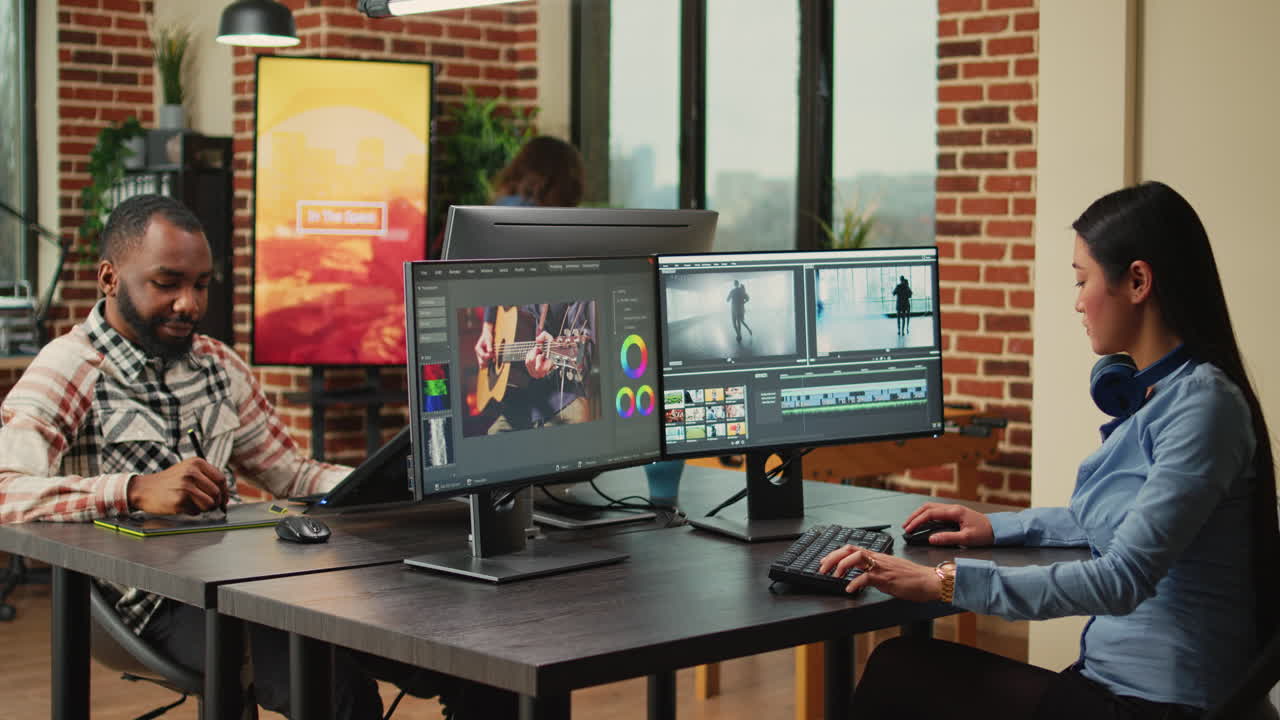 Professional artist working on film footage design with retouching software