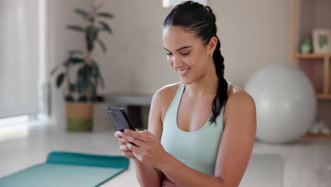 woman using phone after workout