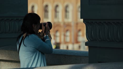 person taking photos on a bridge, capturing scenes during the budapest flood 2024