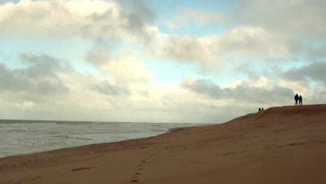 North-beach-or-Praia-de-Norte-in-Nazare,-Portugal,-static-copy-space-view,-people-in-background