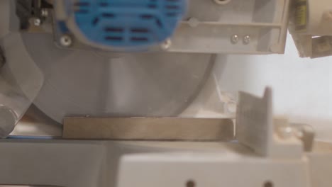 Extreme-Close-Up-Shot-of-a-Circular-Saw-Cutting-Skirting-Board