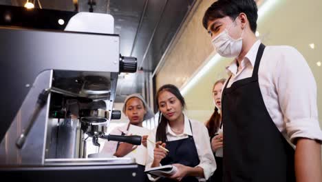 barista learning make coffee by espresso machine. group schoolgirl studying hard to learn how to make espresso coffee at barista school.