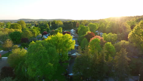 establishing shot of sunset over houses in neighborhood