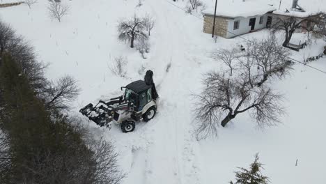 grader pave houses way