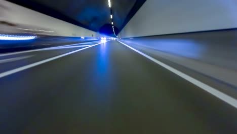 fast driving by a tunnel with preponderance on the asphalt. vehicle shot