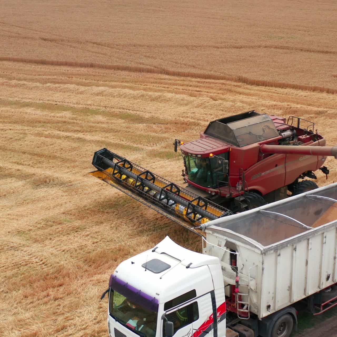 Aerial view countryside farmland. Industrial machinery gathering