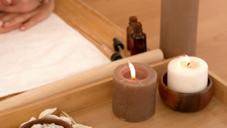 woman enjoying a hot stone massage