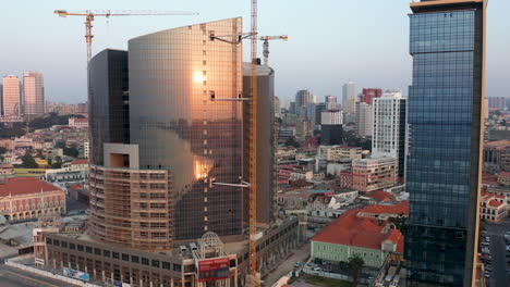 raveling-front,-Luanda-city,-golden-hour-flying-over-Luanda,-Africa,-10