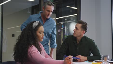 happy diverse business people discussing work during meeting at office