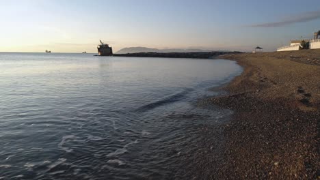 coastal sunrise/sunset scene with pier