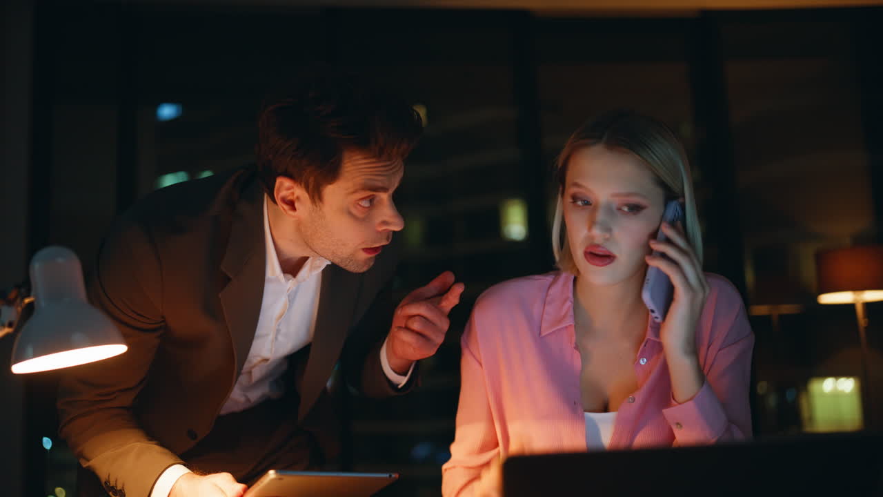 Business people working late at night in the office