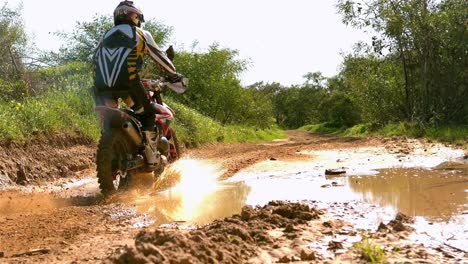 man riding a motor cross bike