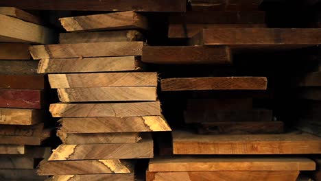 planks of wood and lumber are stacked vertically