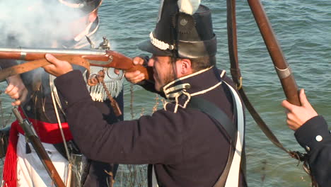 men come out of the woods to fight a battle with arriving soldiers in this television style reenactment of the war of 1812