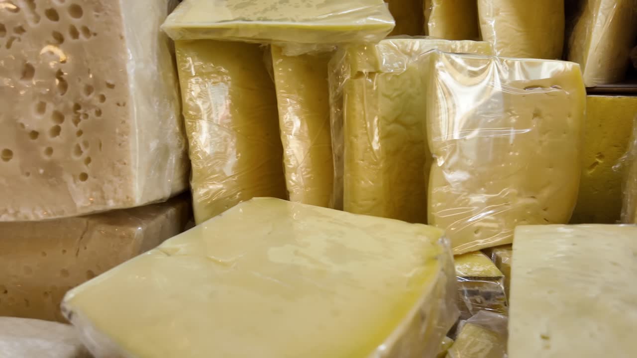 Assortment of Cheese Blocks Wrapped and Unwrapped