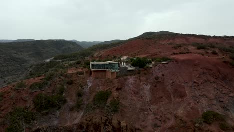 Aerial-view-of-stunning-viewpoint-Mirador-de-Abrante-with-glass-observation-balcony-above-Agulo-village-in-La-Gomera