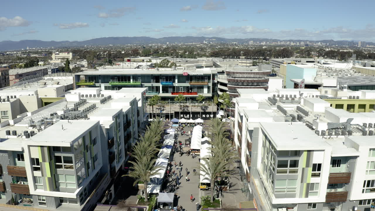 Aerial View of a Bustling Outdoor Market in an Urban Setting