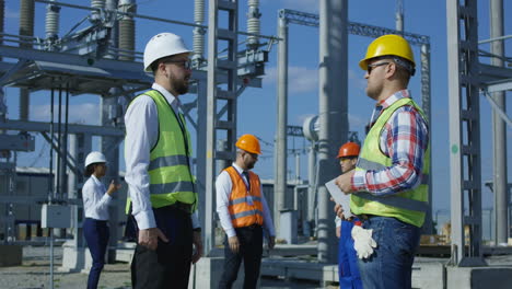 power plant engineers discussing operations