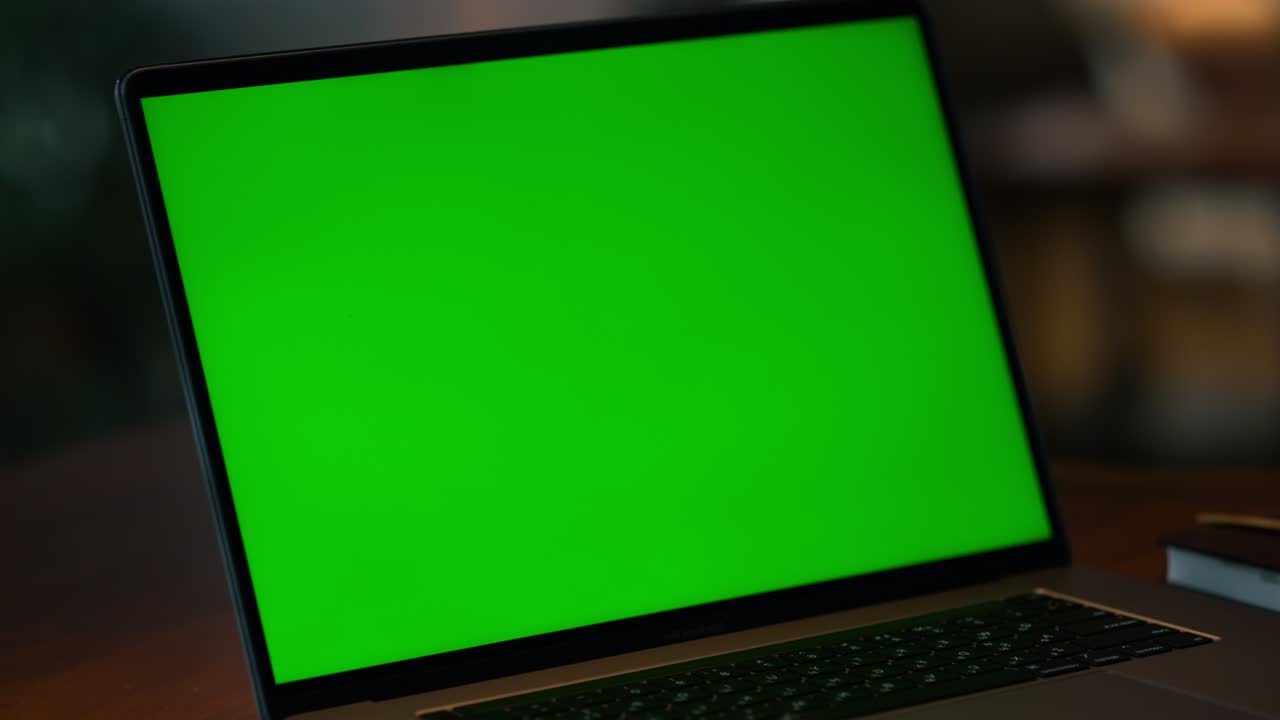 Green screen laptop computer closeup. Closeup mockup display computer