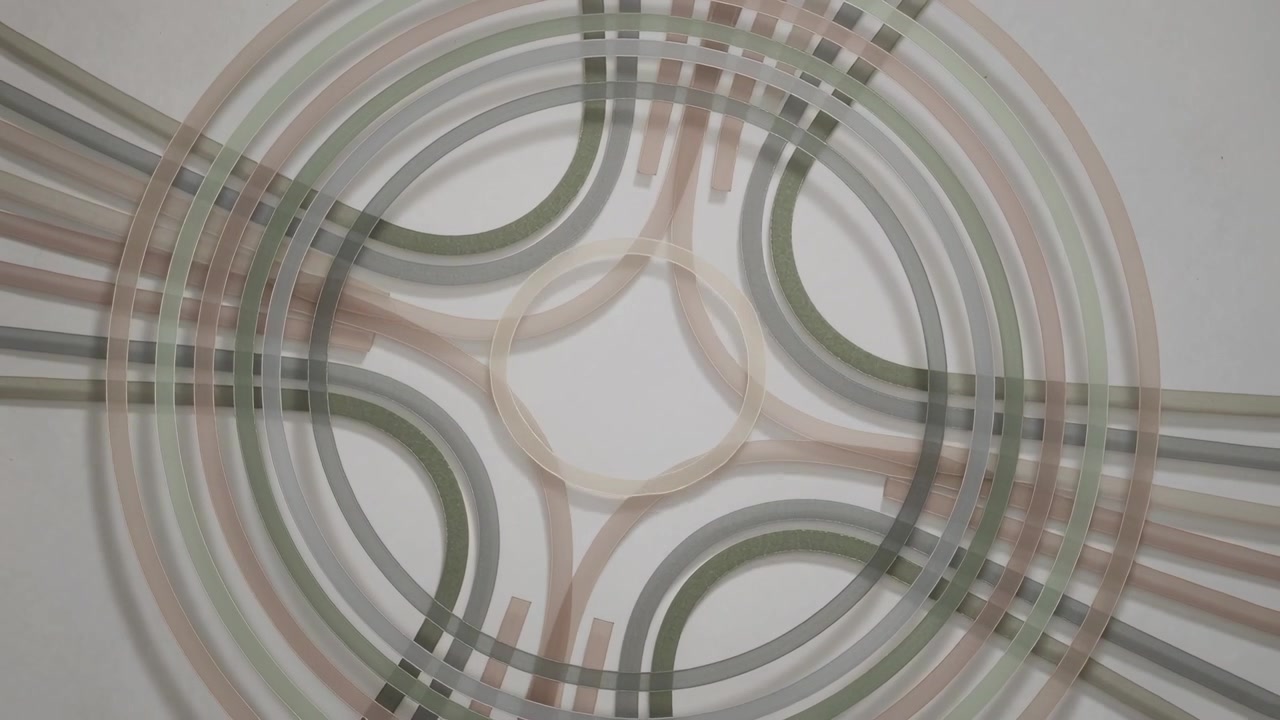 Frames sparking pattern rotating, sheer bands and rings tightening on gray backdrop forming lattice