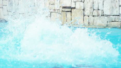 Handsome-man-doing-a-somersault-on-pool