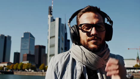 man listening to music in the city