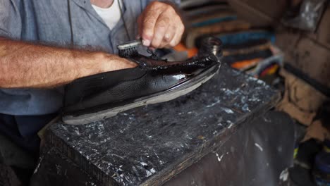 cobbler repairing a shoe