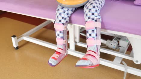 child with leg braces