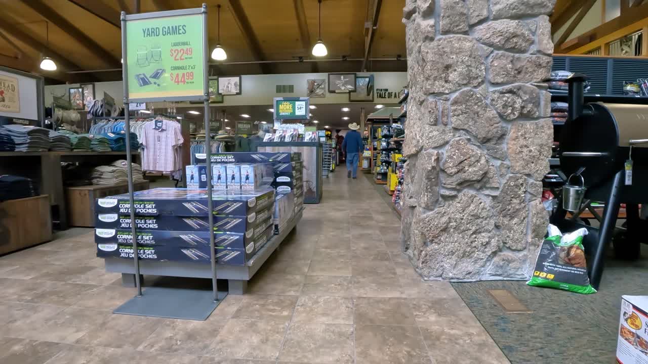 POV - walking between Clothing and Outdoor Cooking departments in Cabela's;concepts of outdoor life and adventure