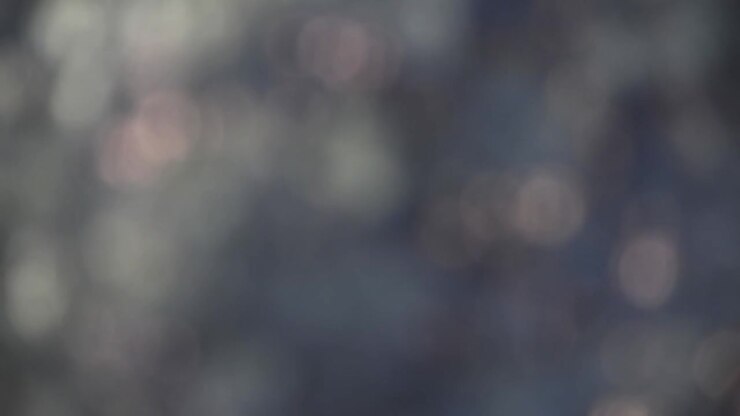 Bokeh blur tree leaves swaying and moving in the wind, light flicker rays simple moving background