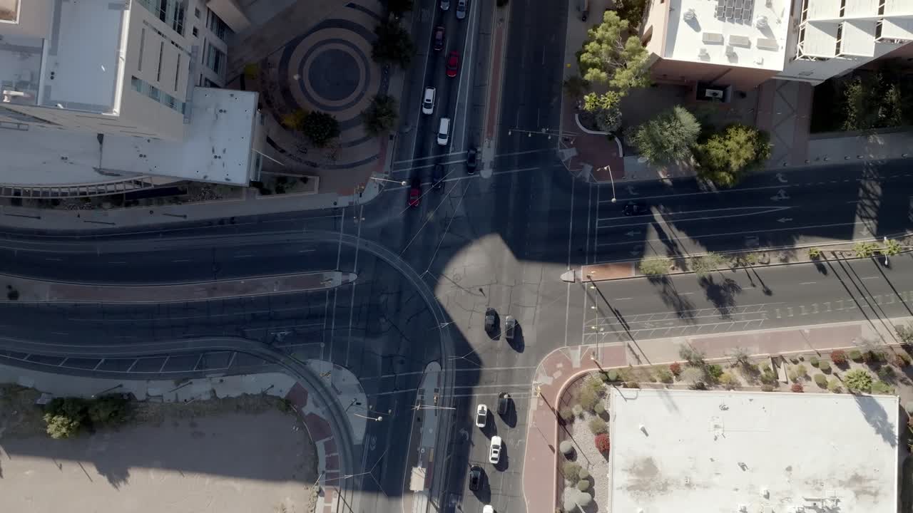 Intersection in downtown Tucson, Arizona with traffic and drone video overhead looking down