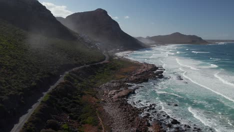 coastal road towards beaches of witsand and scarborough in misty cliffs, cape town, south africa