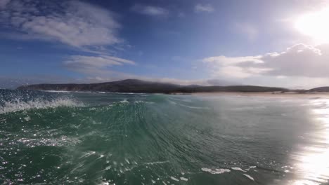 surfers off coast of guincho surf spot, wide and amazing view