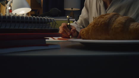 lady hands writing text at home closeup. unknown girl making notes at evening