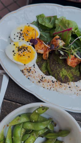 delicious green pancakes with shrimp and salad