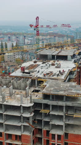 construction site with cranes. aerial shot of the skyscraper building in the process of construction