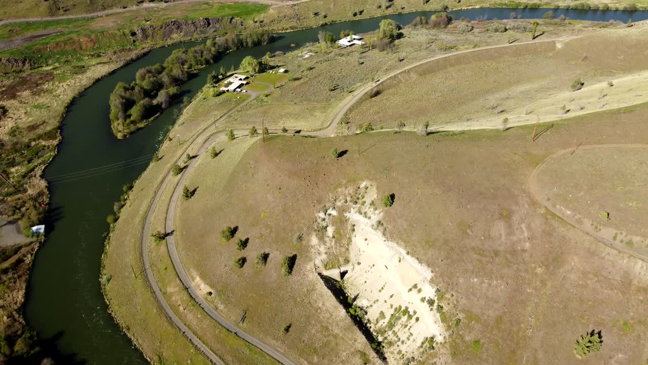 US, Oregon, Warm Springs, , 2025-04-19 - Drone view of an old abandoned train tunnel built in 1906 on the Deschutes River. The highway is US Hwy 26