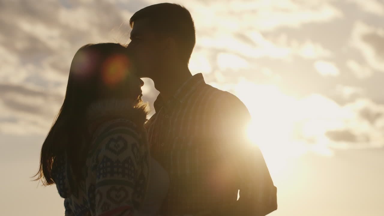 Silhouette Of A Young Couple In Love On The Background Of Sky And Sun  Looking At Each Other Free Stock Video Footage Download Clips Nature