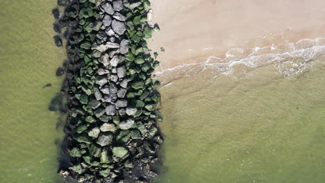 a-top-down-shot-of-a-stone-jetty