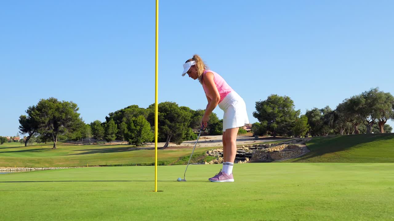 Woman playing golf on a golf course