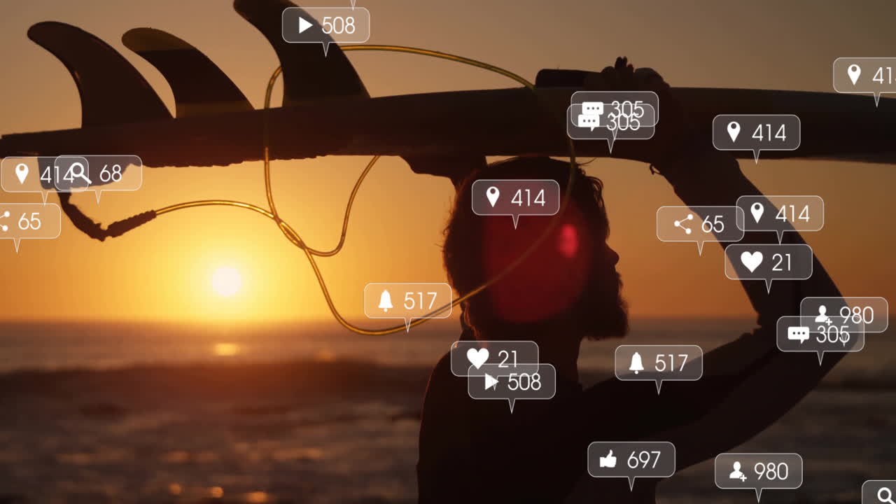 Man carrying surfboard overhead on beach at sunset, showing social media icons floating around