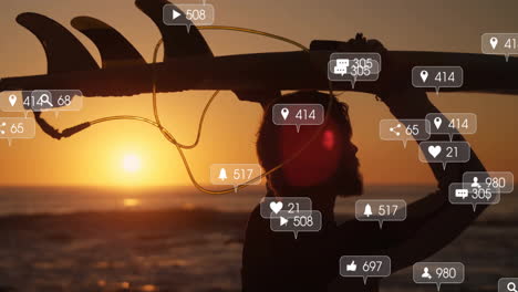 man carrying surfboard overhead on beach at sunset, showing social media icons floating around