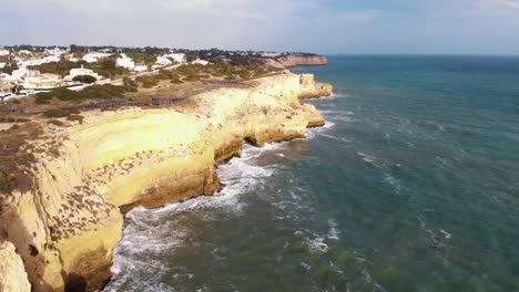 Aerial-4K-drone-footage-of-the-coastline-near-the-resort-city-of-Carvoeiro,-Portugal