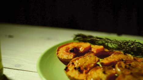 Baked-pumpkin-slices-with-rosemary-herb.-Baked-pumpkin-pieces