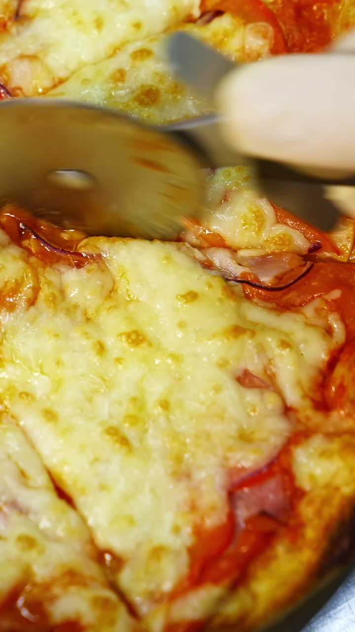 Close up of a delicious pizza being cut